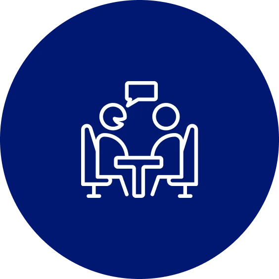 A blue circle with two people sitting at a table